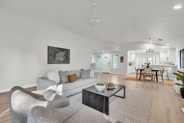 a living room with furniture and a table