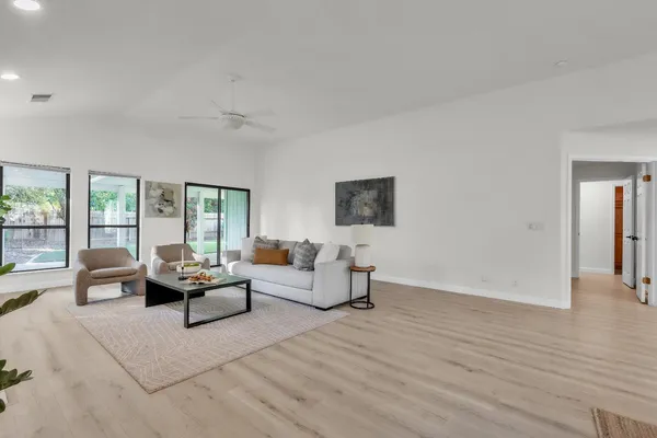 a living room with furniture and a large window