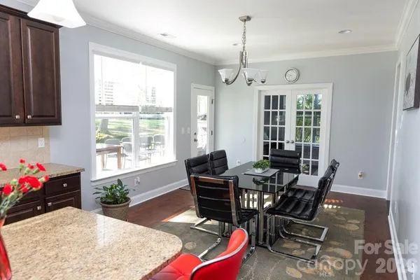 a view of a dining room with furniture and window