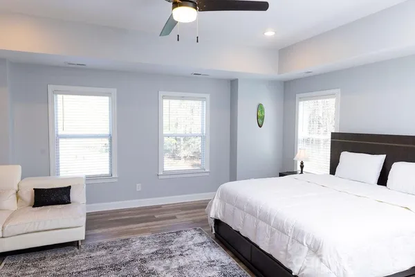 a bedroom with a large bed and a window