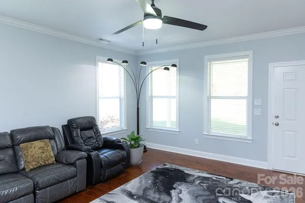 a living room with furniture and a window