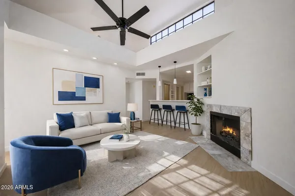 a living room with furniture and a fireplace