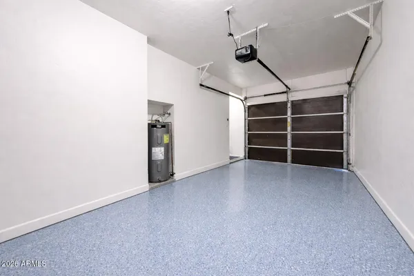 a view of a big room with a ceiling fan