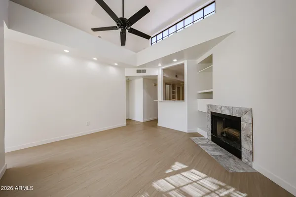 a view of an empty room with a fireplace