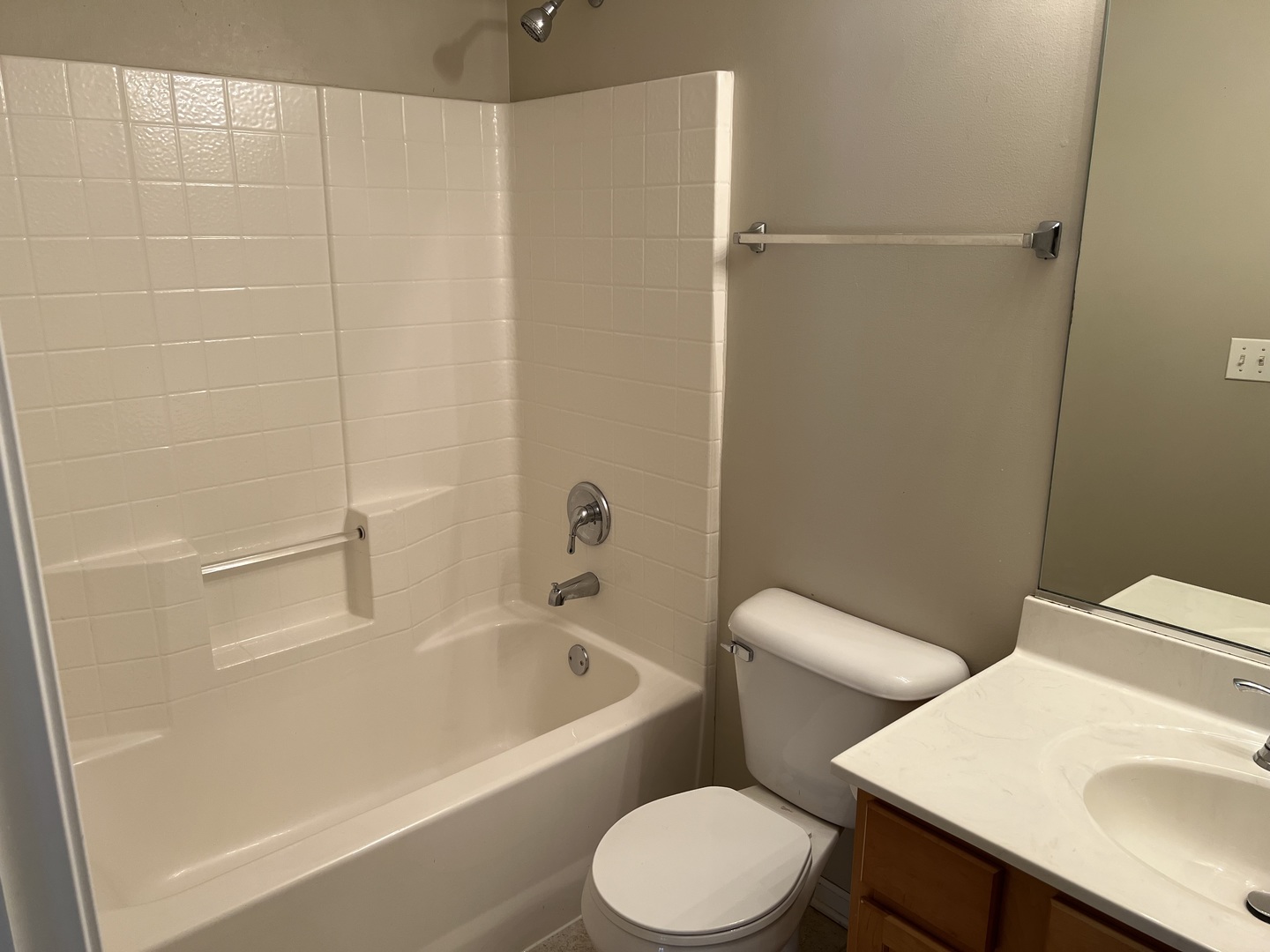 26112 Mapleview Drive Plainfield, IL 60585 - Photo 16 of 28 a white toilet sitting next to a bath tub