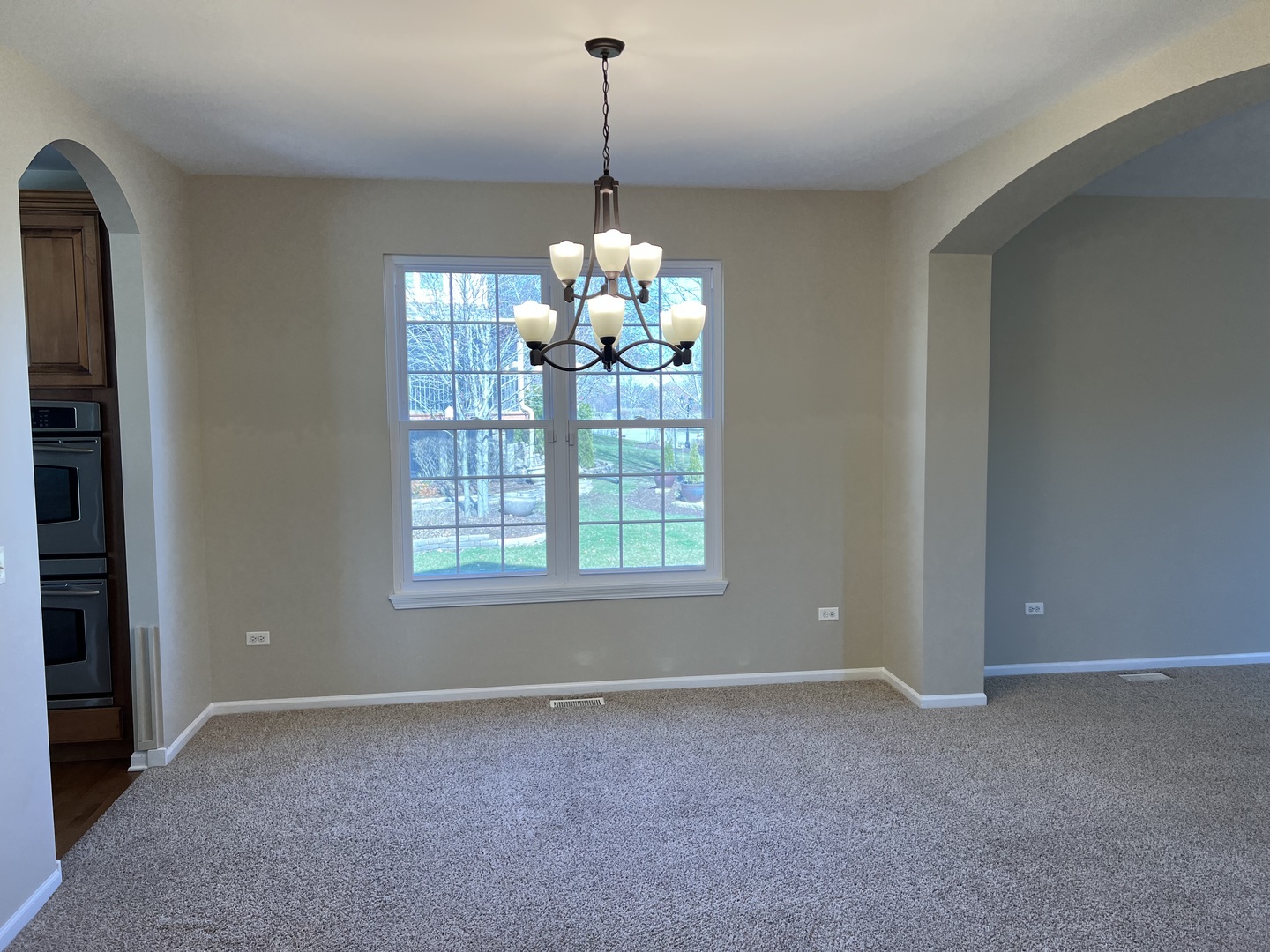 26112 Mapleview Drive Plainfield, IL 60585 - Photo 3 of 28 a room with window and chandelier