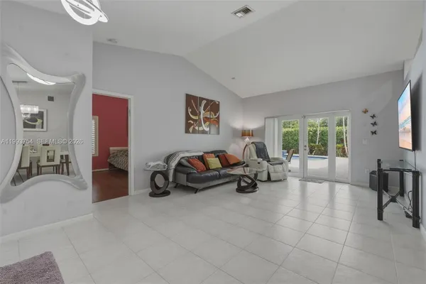a living room with furniture and a flat screen tv