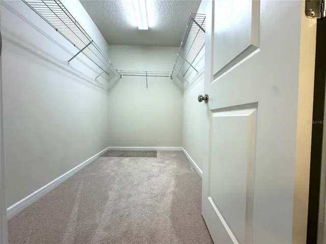 an empty room with a empty space and windows