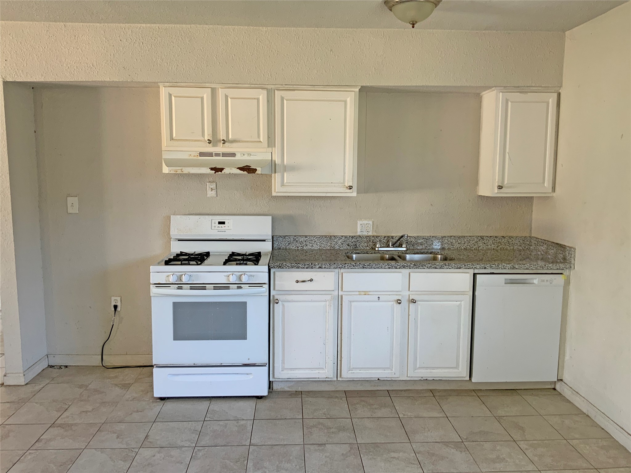 1736 Lynn Lane Freeport, TX 77541 - Photo 11 of 14 a kitchen with granite countertop white cabinets stainless steel appliances and sink