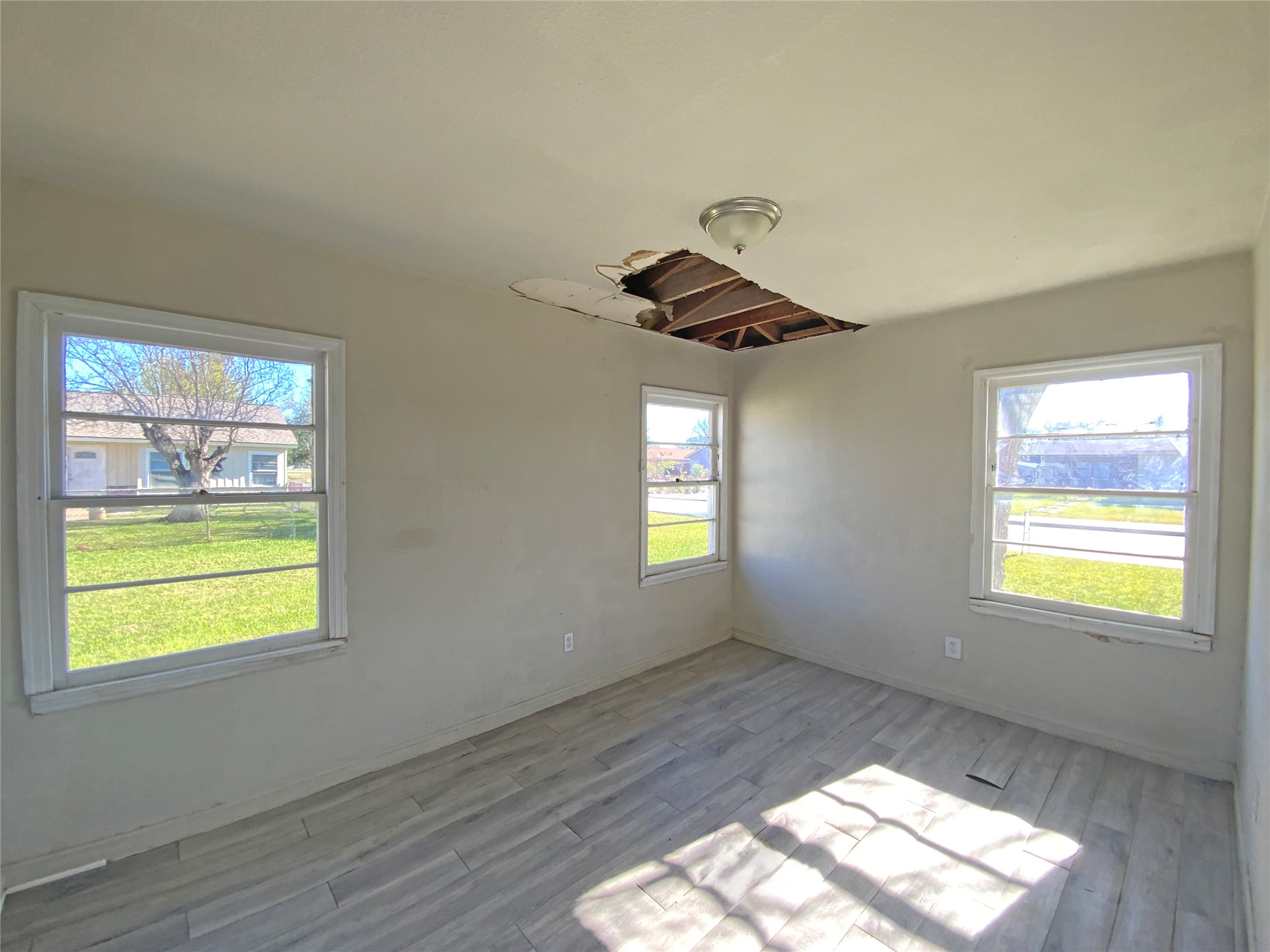 1736 Lynn Lane Freeport, TX 77541 - Photo 12 of 14 a view of an empty room and window
