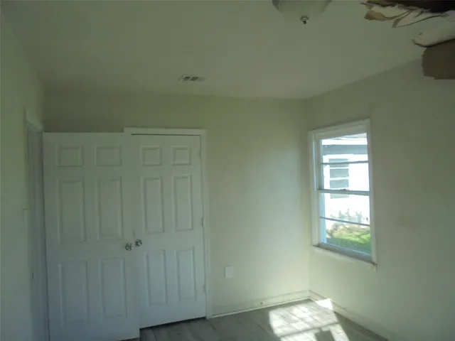 a view of an empty room and window