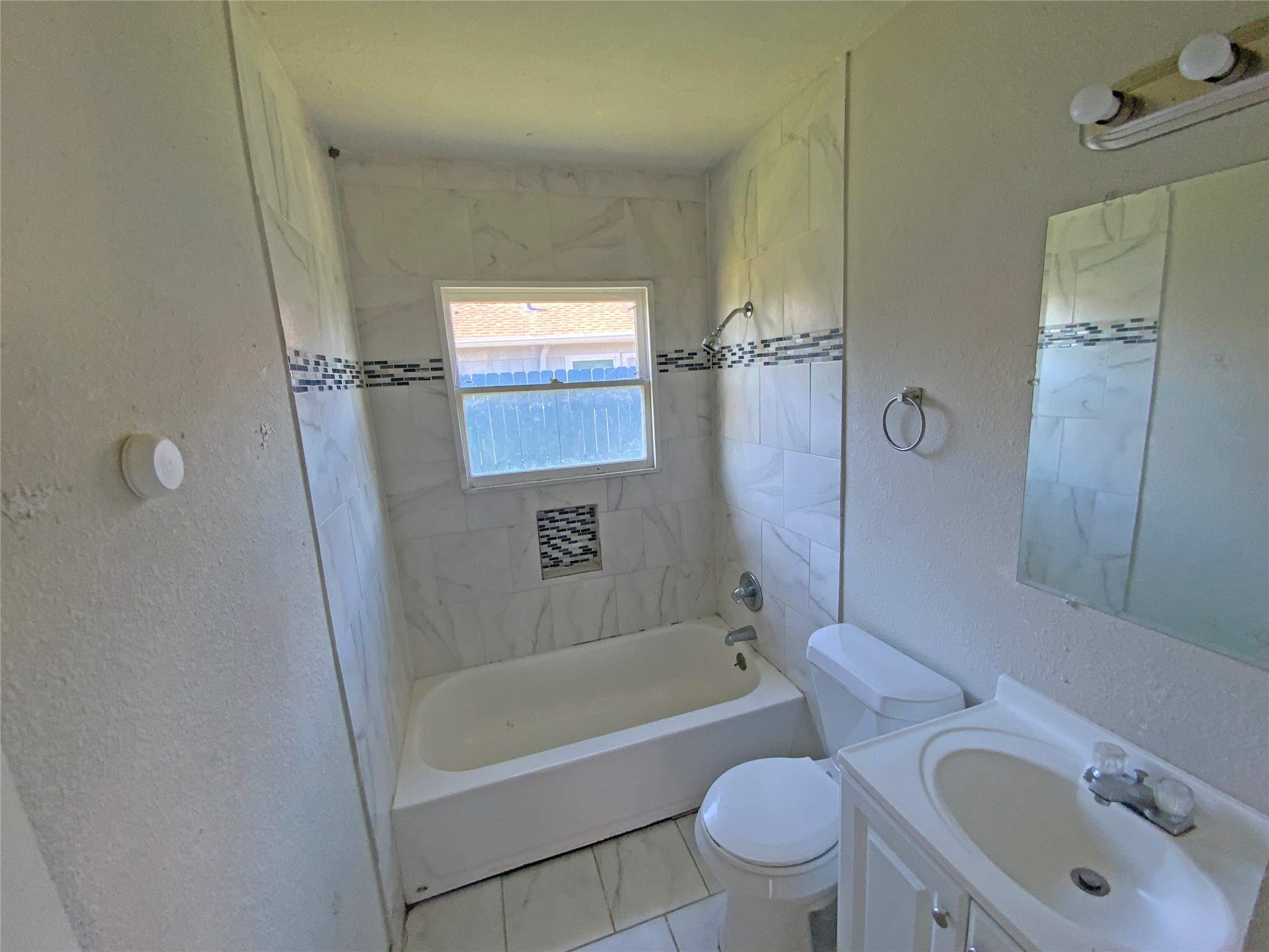 1736 Lynn Lane Freeport, TX 77541 - Photo 14 of 14 a bathroom with a sink a toilet and shower