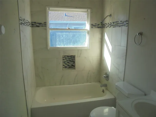 a bathroom with a bath tub
