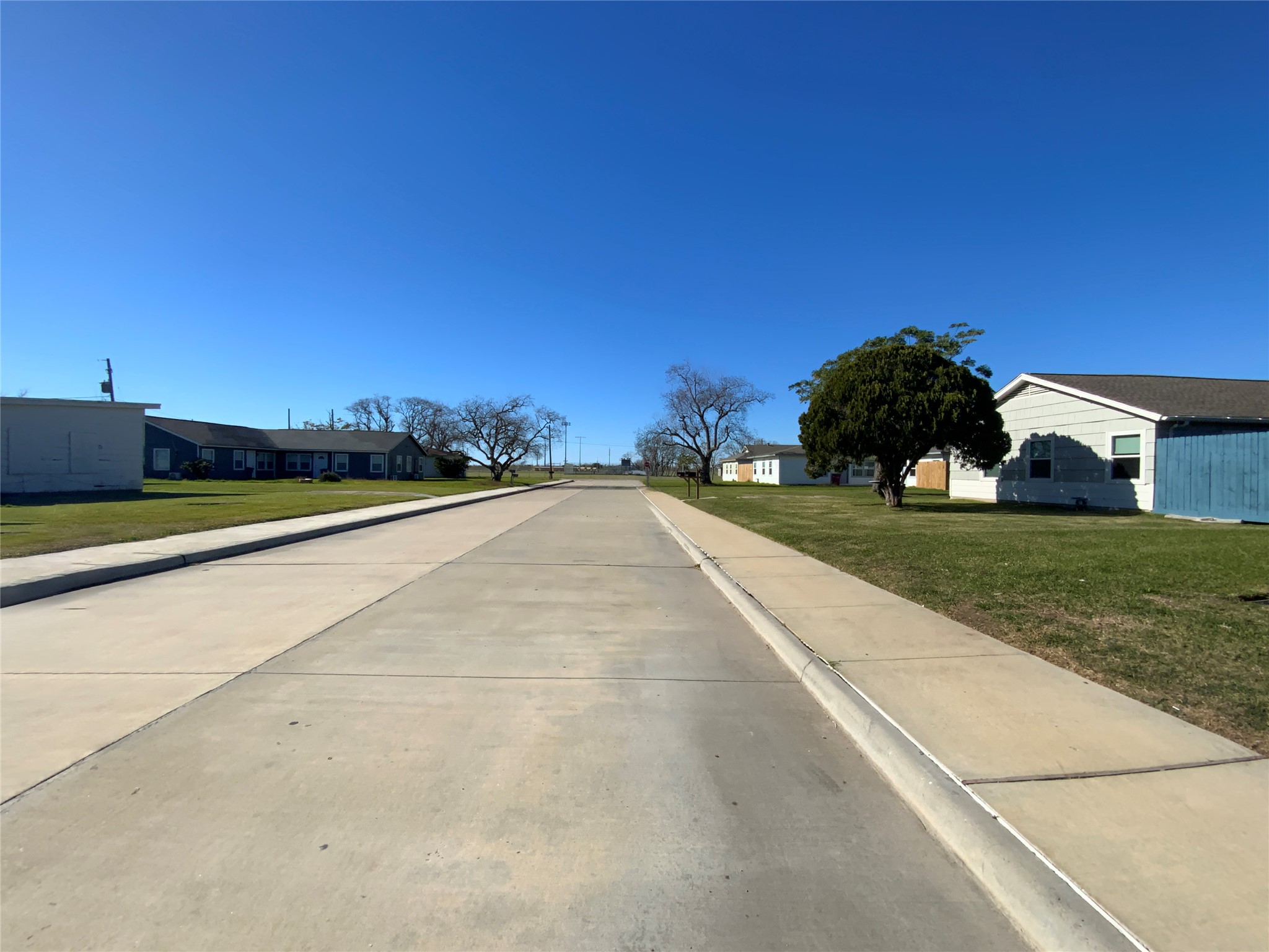 1736 Lynn Lane Freeport, TX 77541 - Photo 2 of 14 a view of swimming pool with outdoor seating and house in the background