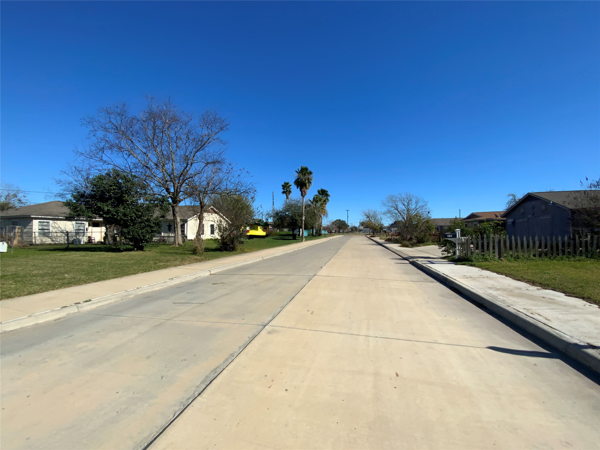 1736 Lynn Lane Freeport, TX 77541 - Photo 3 of 14 a view of a street with a building in the background