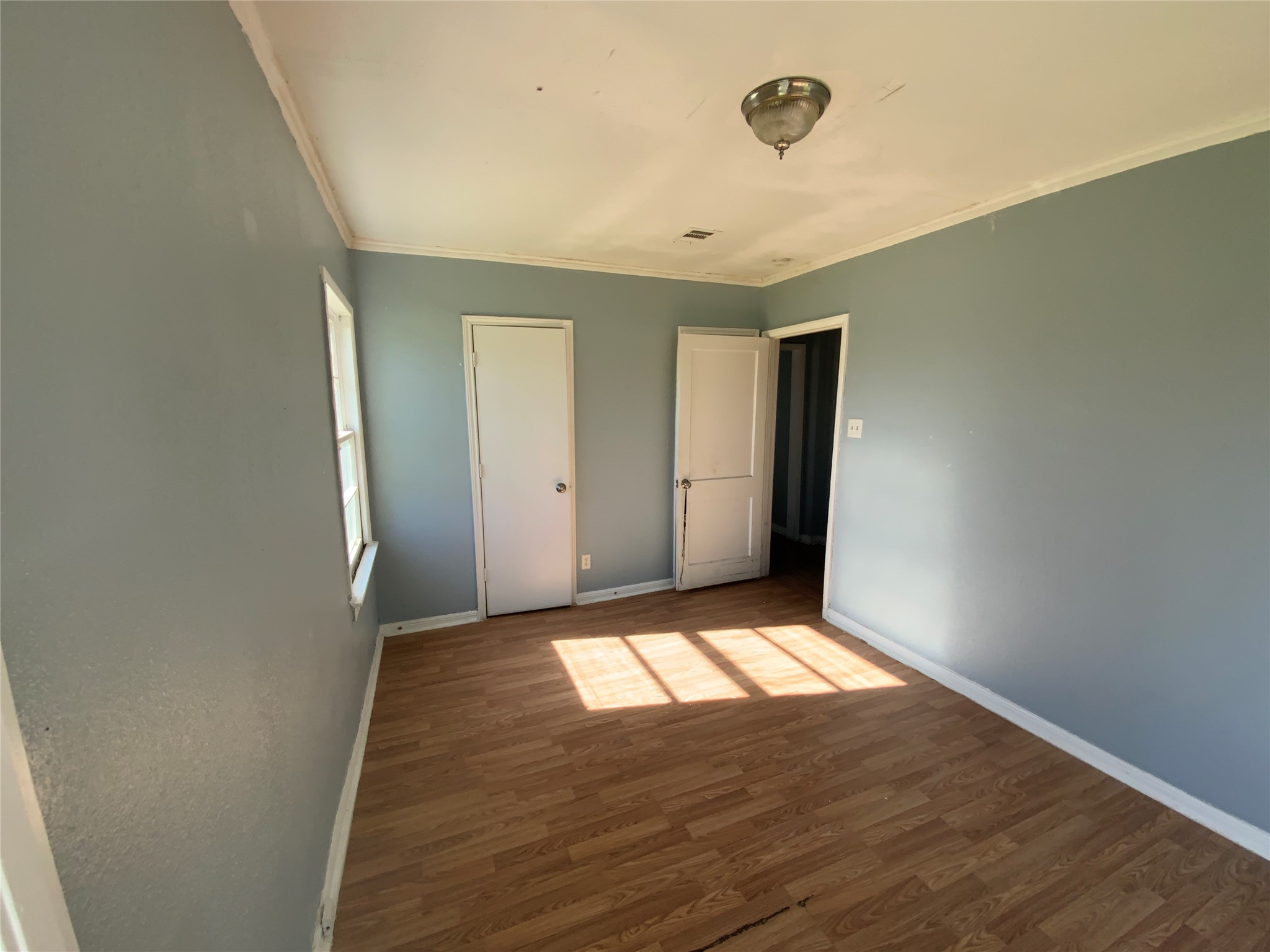 1736 Lynn Lane Freeport, TX 77541 - Photo 7 of 14 a view of an empty room and window