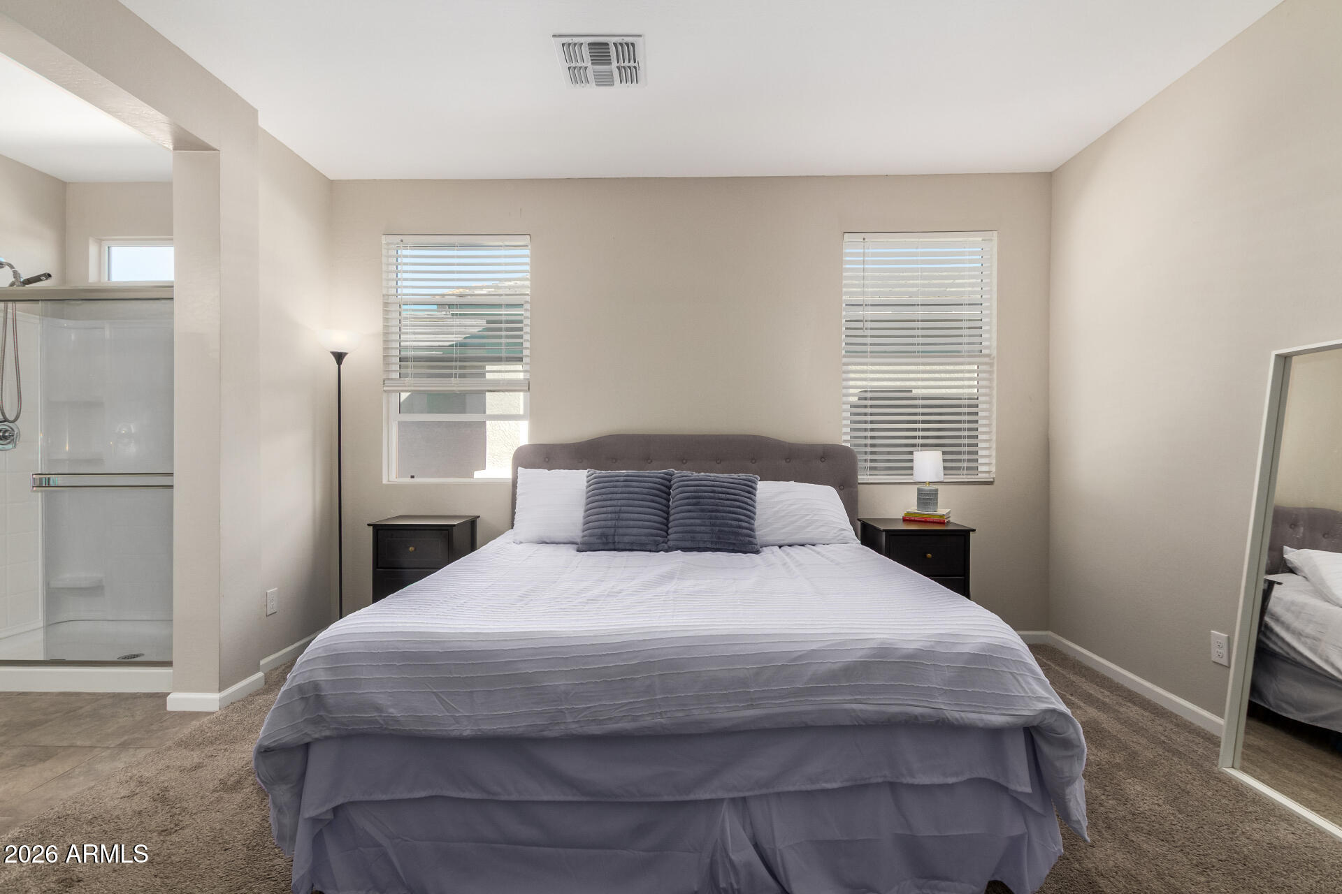 17449 West Patrick Lane Surprise, AZ 85387 - Photo 15 of 28 a bedroom with a bed and a window