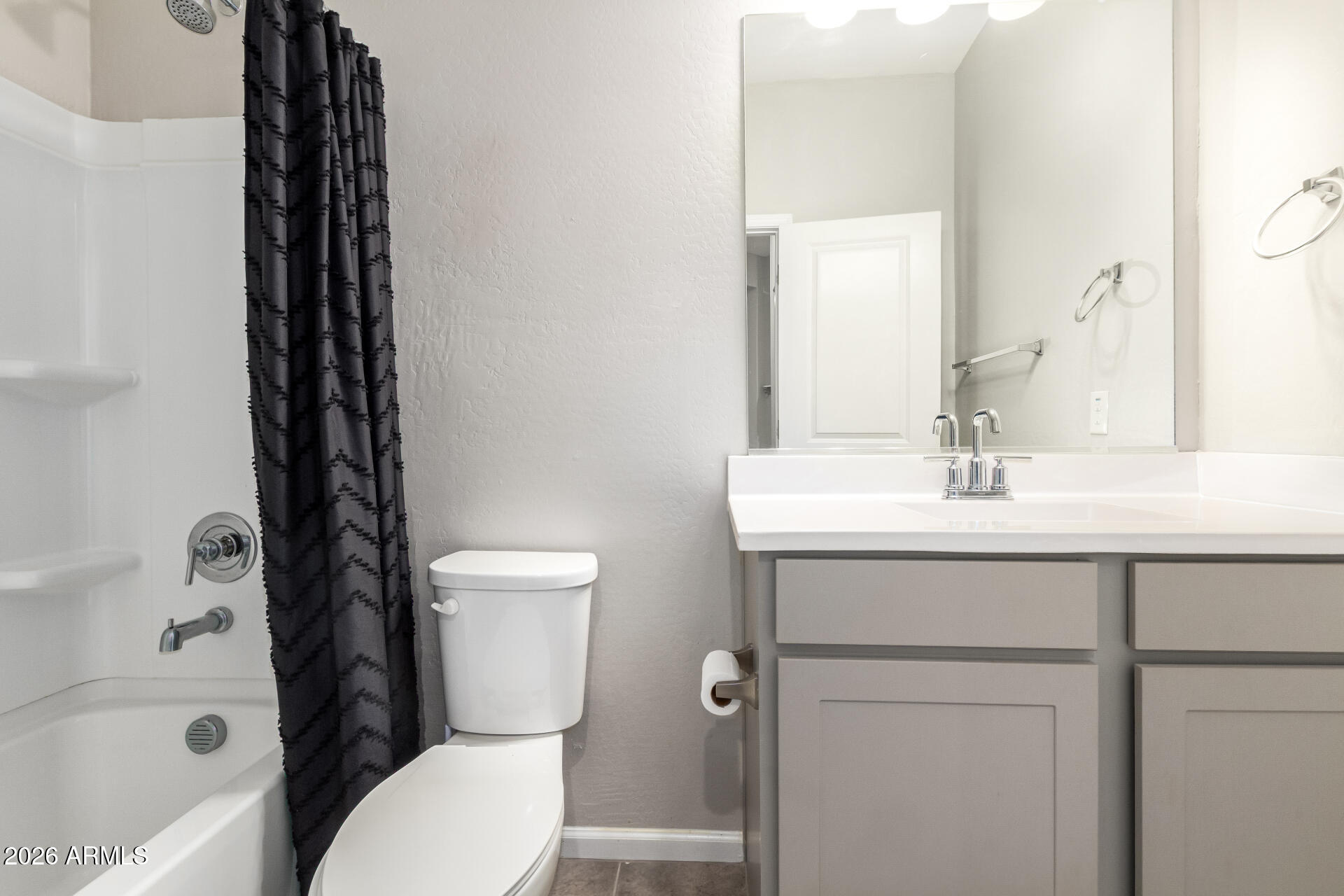 17449 West Patrick Lane Surprise, AZ 85387 - Photo 21 of 28 a bathroom with a sink a toilet and shower