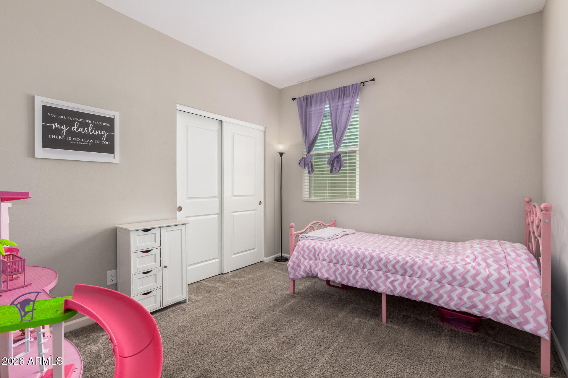 17449 West Patrick Lane Surprise, AZ 85387 - Photo 22 of 28 a bedroom with a bed and a closet