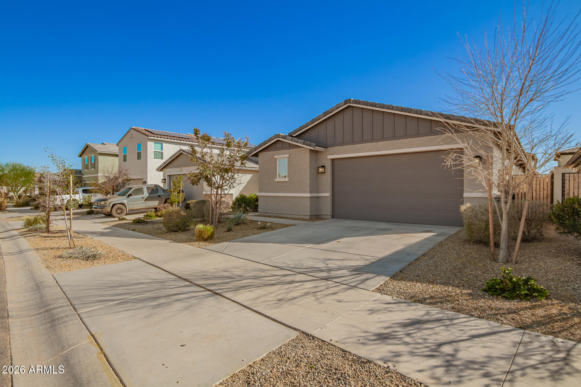 17449 West Patrick Lane Surprise, AZ 85387 - Photo 3 of 28 a view of a house with a yard