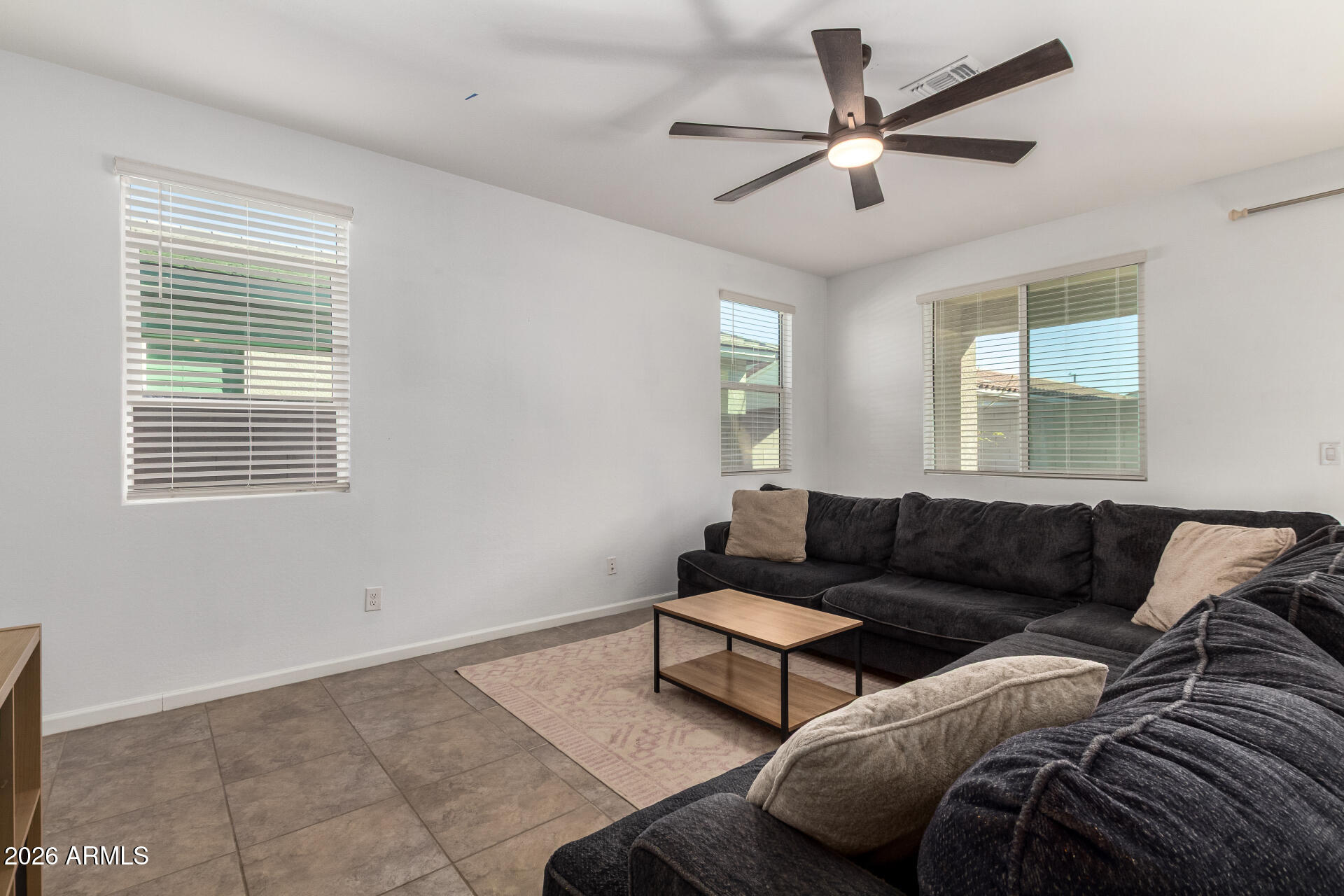 17449 West Patrick Lane Surprise, AZ 85387 - Photo 5 of 28 a living room with furniture and a window