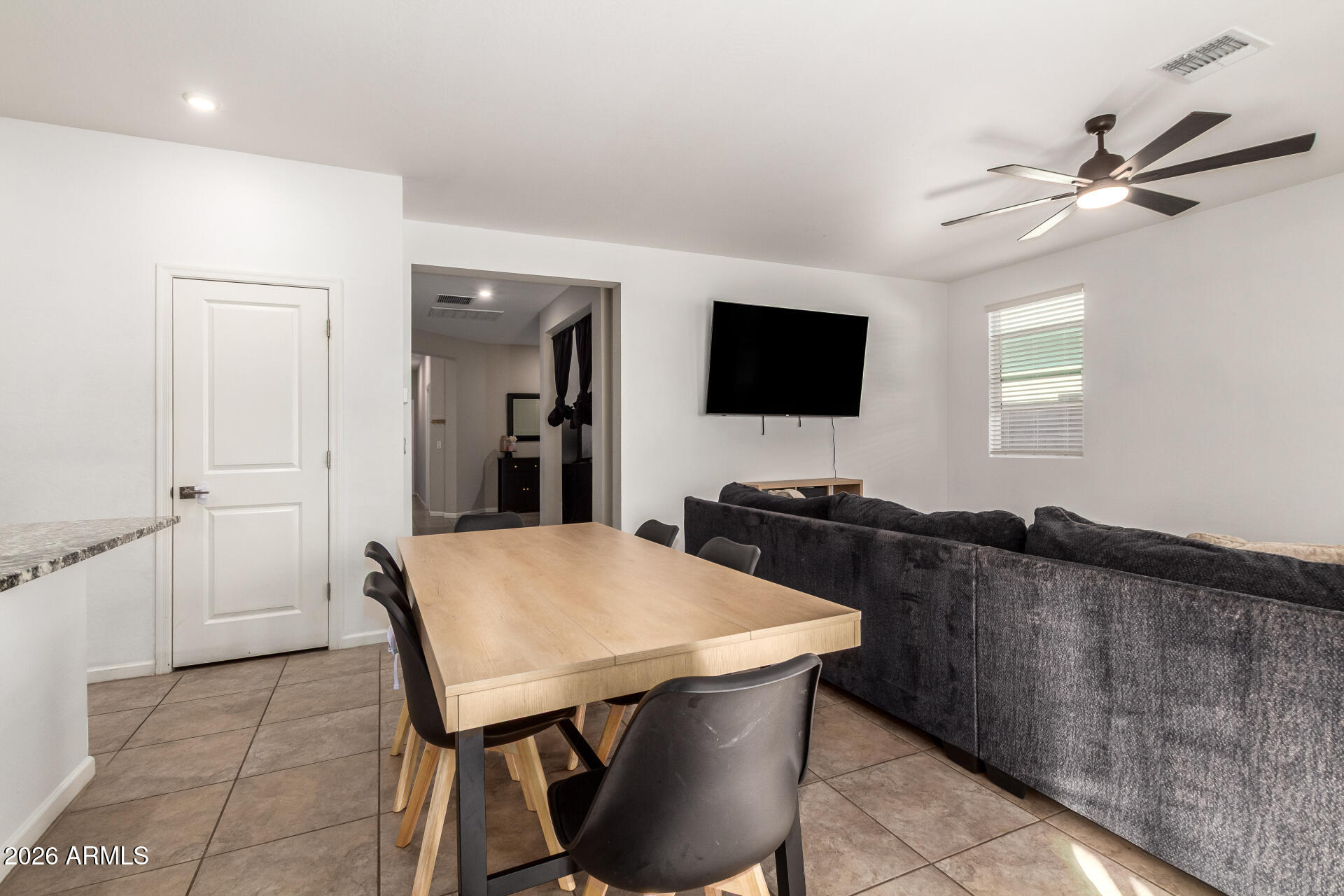 17449 West Patrick Lane Surprise, AZ 85387 - Photo 8 of 28 a living room with furniture and a flat screen tv