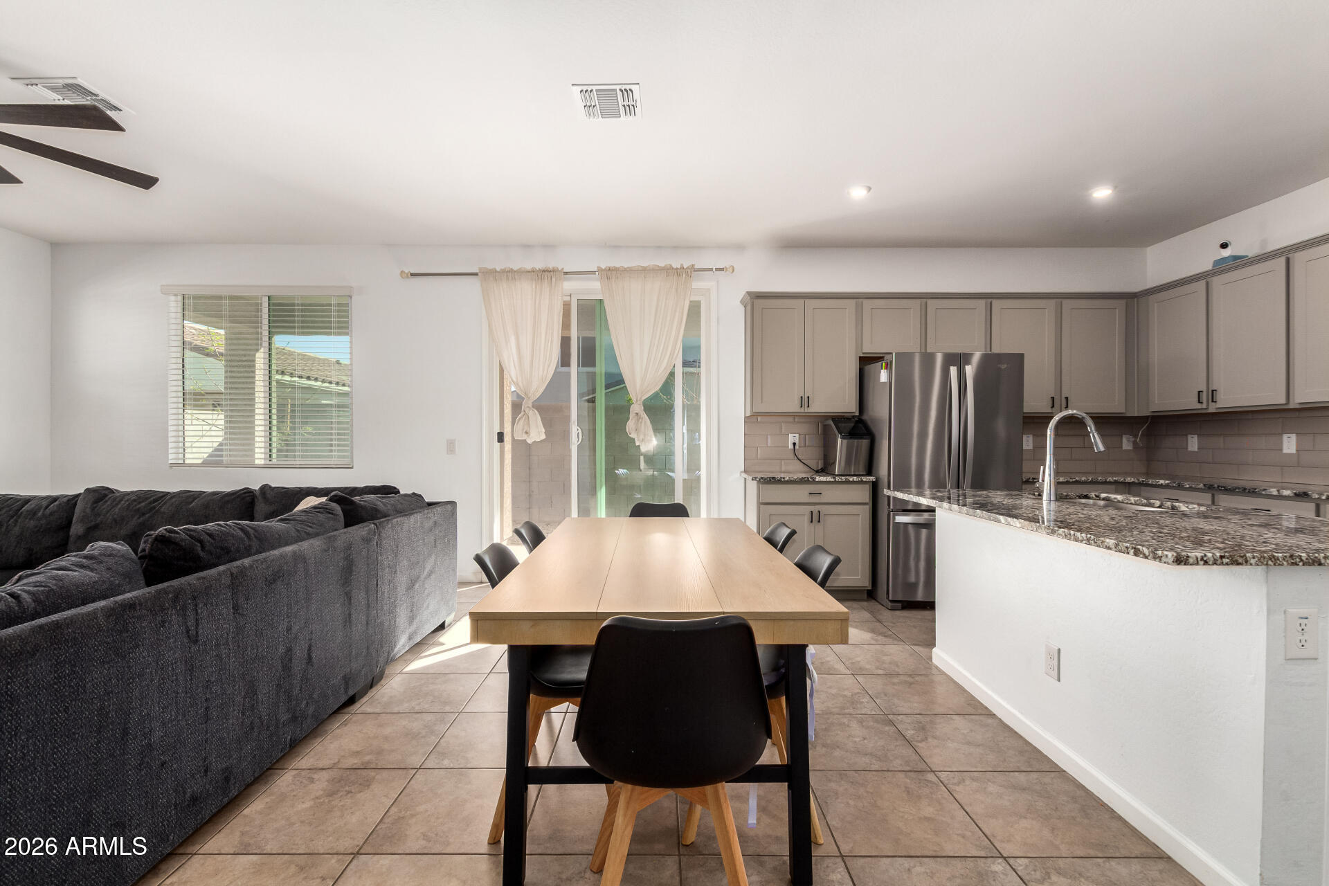 17449 West Patrick Lane Surprise, AZ 85387 - Photo 9 of 28 a large kitchen with granite countertop lots of counter space and window