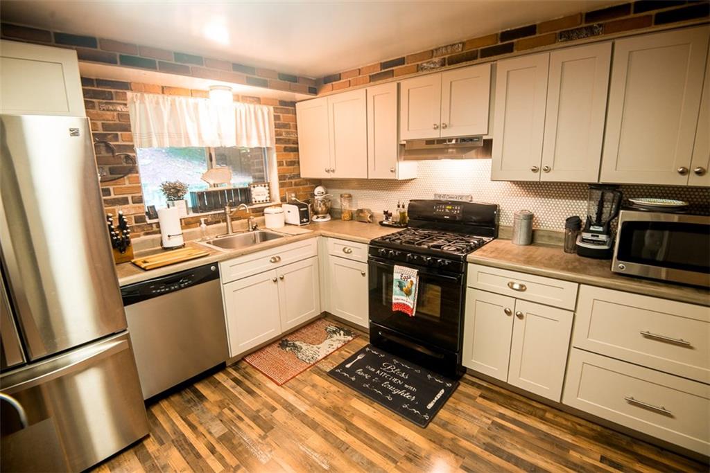 228 Hillendale Road Pittsburgh, PA 15237 - Photo 8 of 25 Beautifully updated kitchen with stainless steel appliances and gas stove.