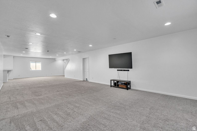 3269 West 650 North Layton, UT 84041 - Photo 20 of 35 Expansive recreation room featuring gray carpet, recessed lighting, a single window, and a white interior door