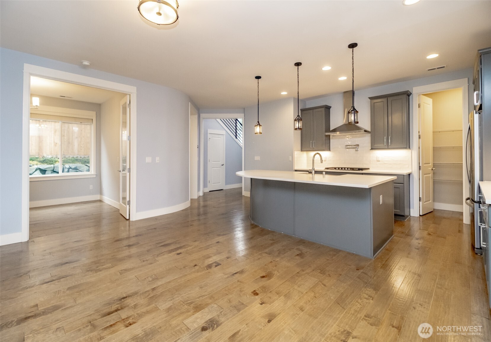 31340 43rd Place Southwest Federal Way, WA 98023 - Photo 7 of 28 a large kitchen with kitchen island a sink stainless steel appliances and cabinets