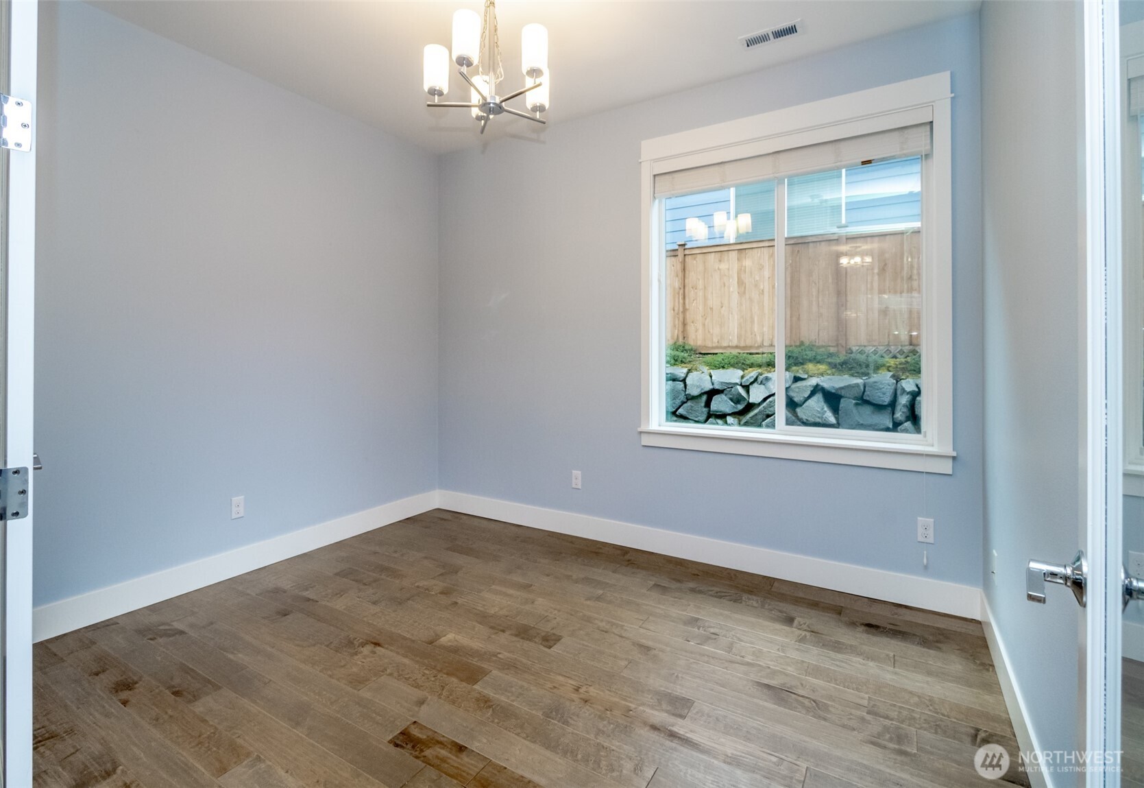 31340 43rd Place Southwest Federal Way, WA 98023 - Photo 10 of 28 an empty room with wooden floor chandelier and window