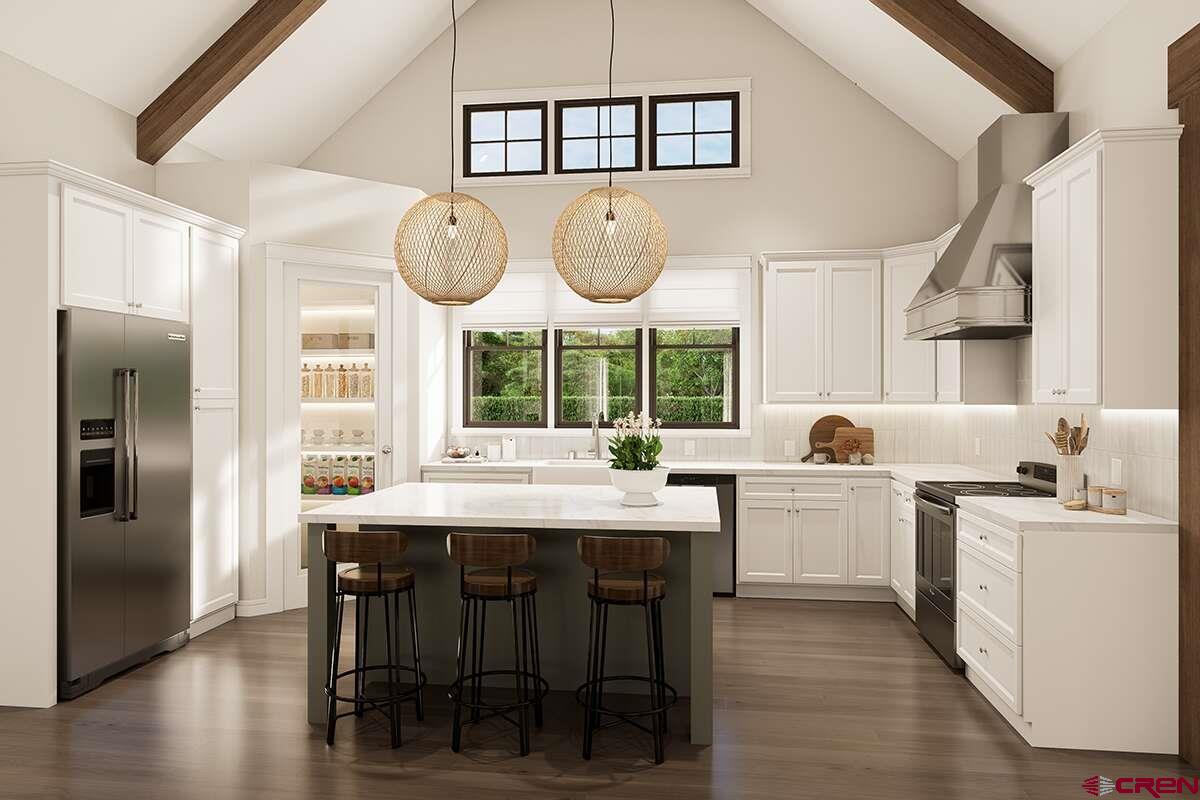 18371 2325 Road Cedaredge, CO 81413 - Photo 6 of 14 a kitchen with stainless steel appliances kitchen island granite countertop a table chairs and a large window