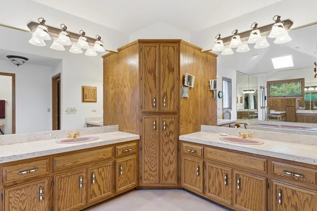 a bedroom with a bed chair and window