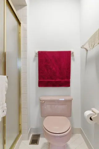 a bedroom with a bed and cabinet