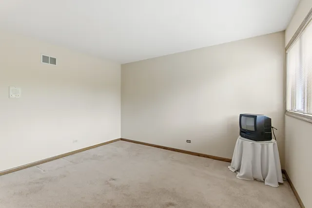 a spacious bathroom with a double vanity sink double and a mirror