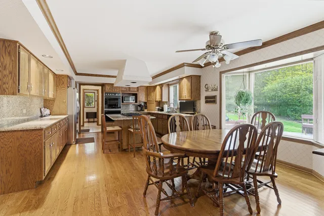 a dining room with furniture window wooden floor