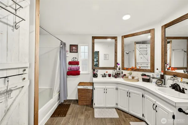 a bathroom with a double vanity sink mirror and double