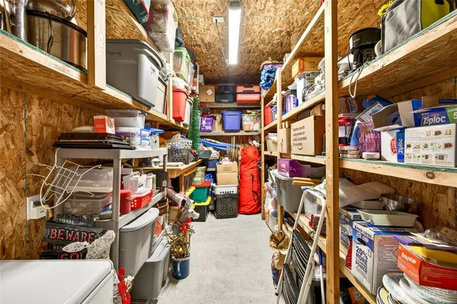 a view of a house with swimming pool and a yard