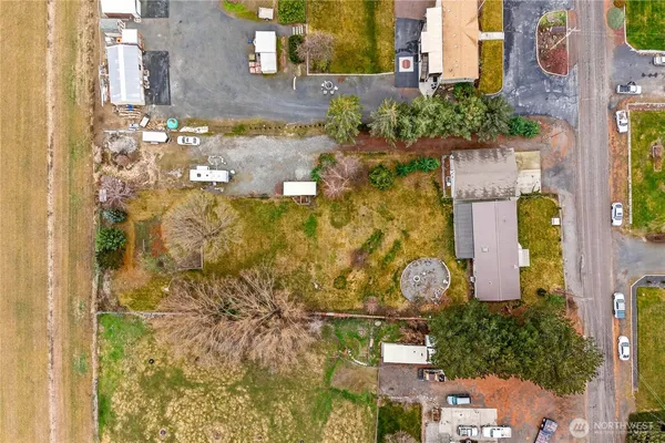 an aerial view of a house with a yard