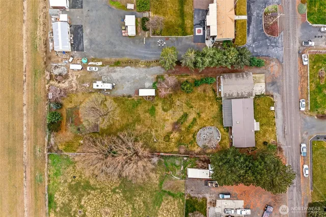 an aerial view of a house with a yard