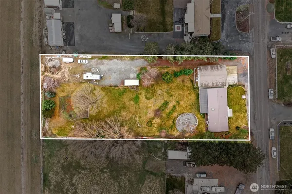 a view of a backyard with swimming pool