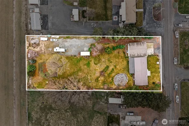 a view of a backyard with swimming pool