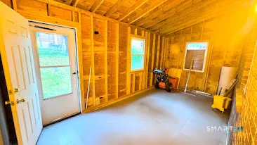 a view of front door with wooden floor