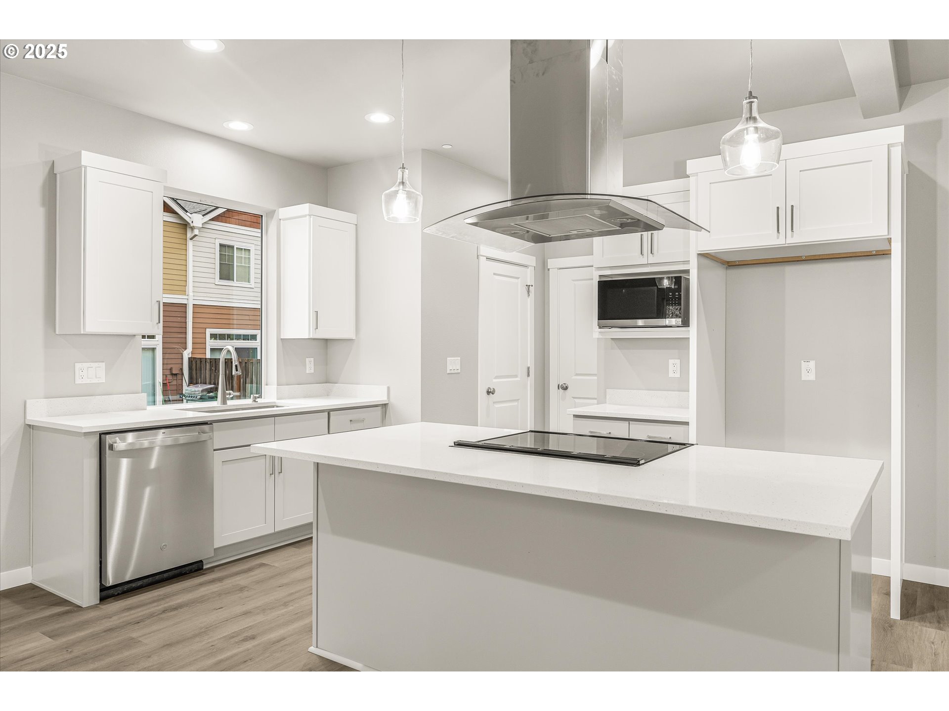 181 Southwest Mawrcrest Avenue Gresham, OR 97030 - Photo 14 of 37 a kitchen with kitchen island granite countertop a sink cabinets and stainless steel appliances