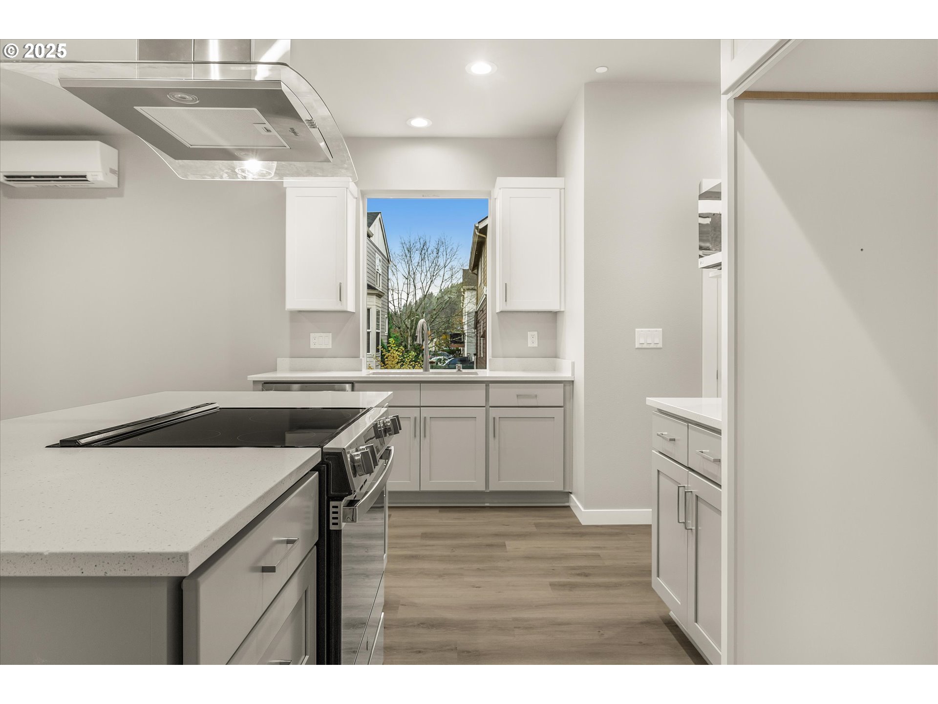 181 Southwest Mawrcrest Avenue Gresham, OR 97030 - Photo 15 of 37 a kitchen with a sink stove and cabinets