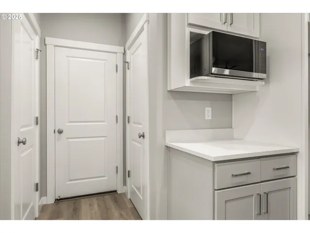 a kitchen with a sink and a mirror
