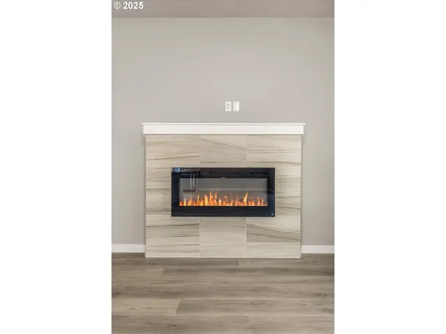 a view of an empty room with glass door