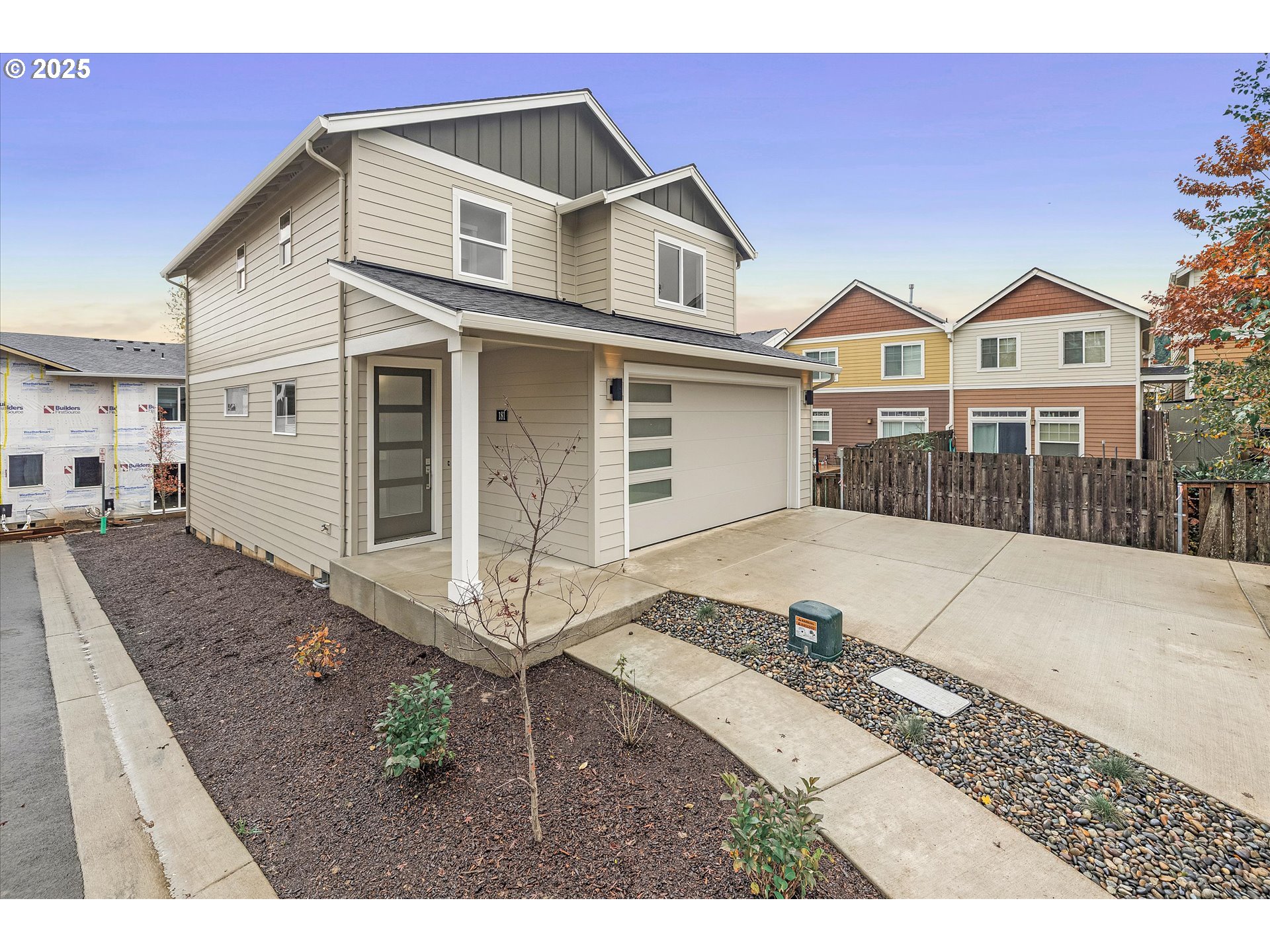 181 Southwest Mawrcrest Avenue Gresham, OR 97030 - Photo 8 of 37 a view of a white house with large windows