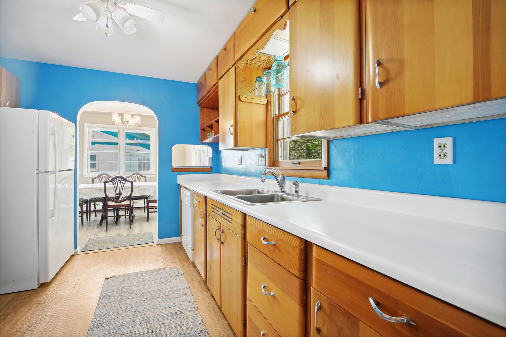 1008 South Mattis Avenue Champaign, IL 61821 - Photo 11 of 25 a kitchen with stainless steel appliances granite countertop a refrigerator a stove and a sink with wooden floor