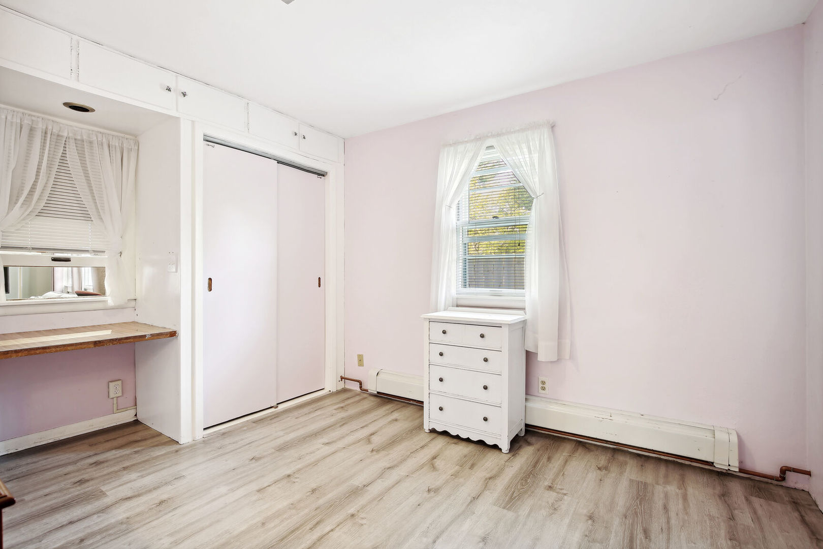 1008 South Mattis Avenue Champaign, IL 61821 - Photo 19 of 25 an empty room with wooden floor and windows